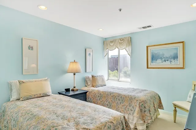 a bedroom with double bed and a lamp