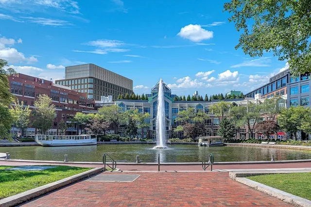 a view of a swimming pool with outdoor seating