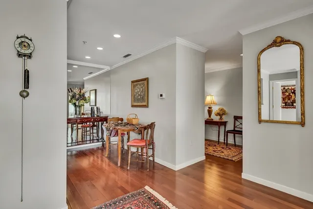 a view of a livingroom with furniture and hardwood floor