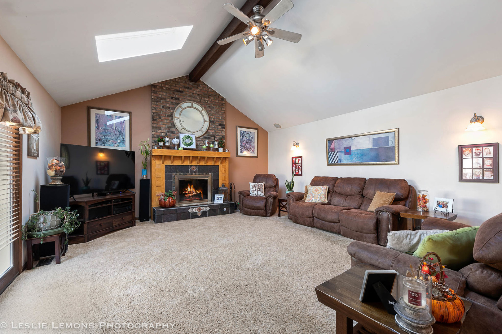 217 West Bailey Road Naperville, IL 60565 - Photo 5 of 24 a living room with furniture a fireplace and a flat screen tv