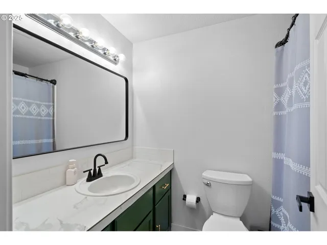 a bathroom with a sink and mirror