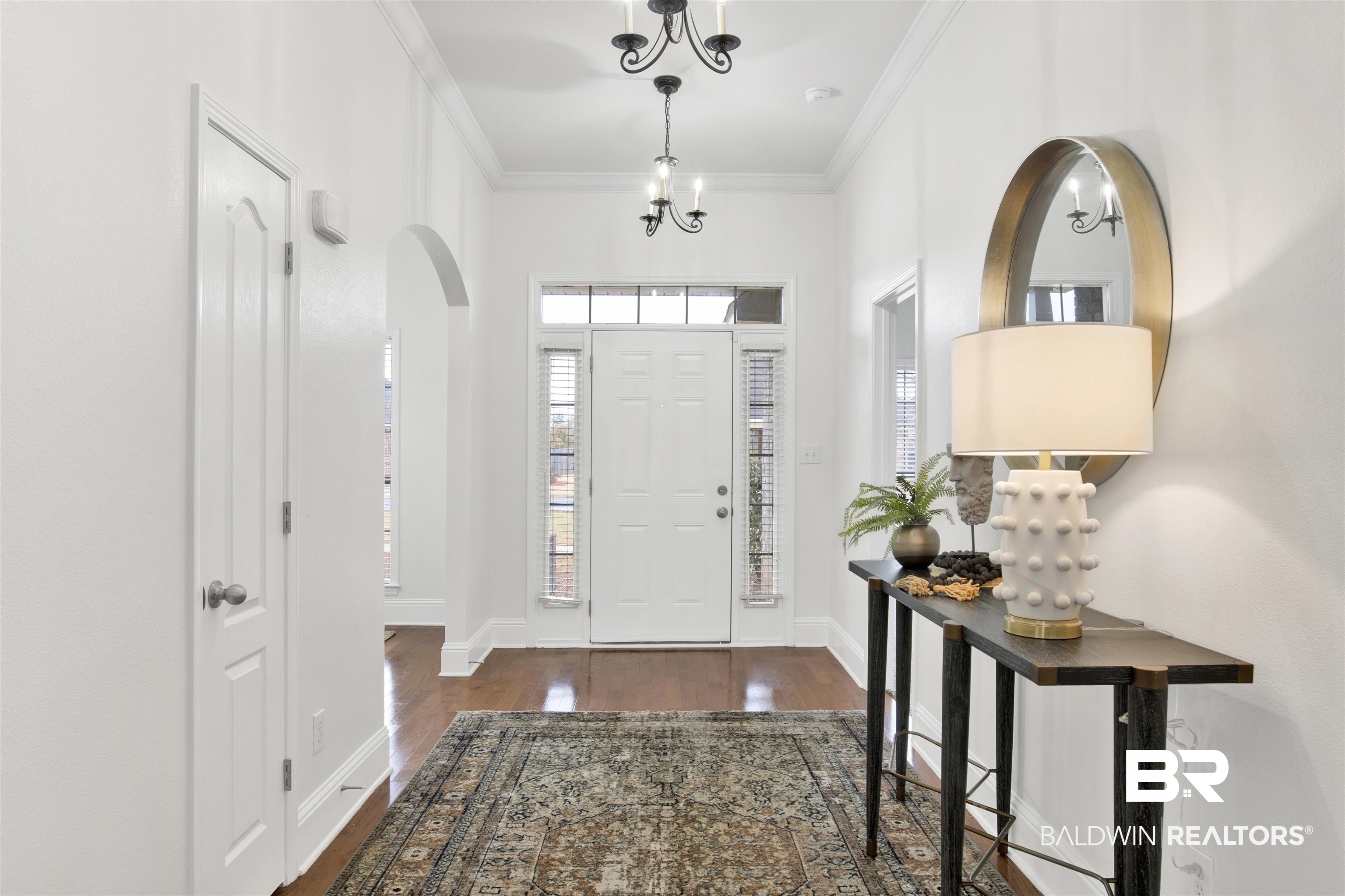 25350 Spindle Lane Daphne, AL 36526 - Photo 2 of 32 Entrance foyer with crown molding and dark wood-type flooring