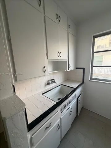 a view of a kitchen with electric appliances