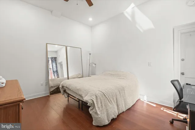 a kitchen with a refrigerator and a stove top oven