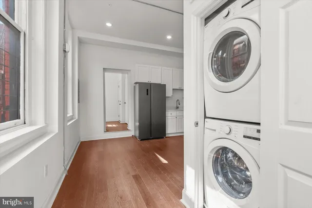 a kitchen with a sink stove and refrigerator