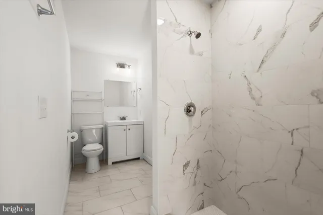 a kitchen with stainless steel appliances a sink stove and refrigerator