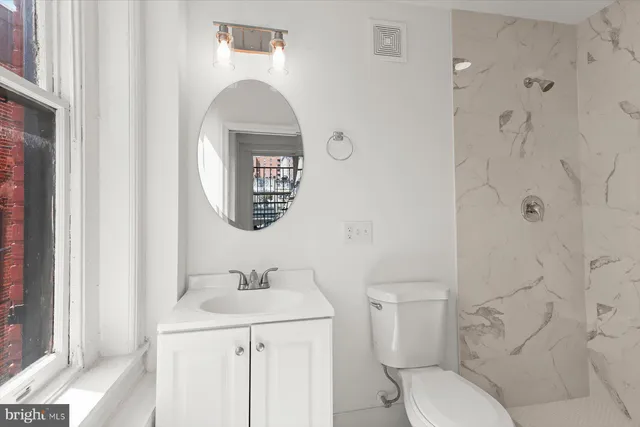 a kitchen with stainless steel appliances a stove microwave and sink