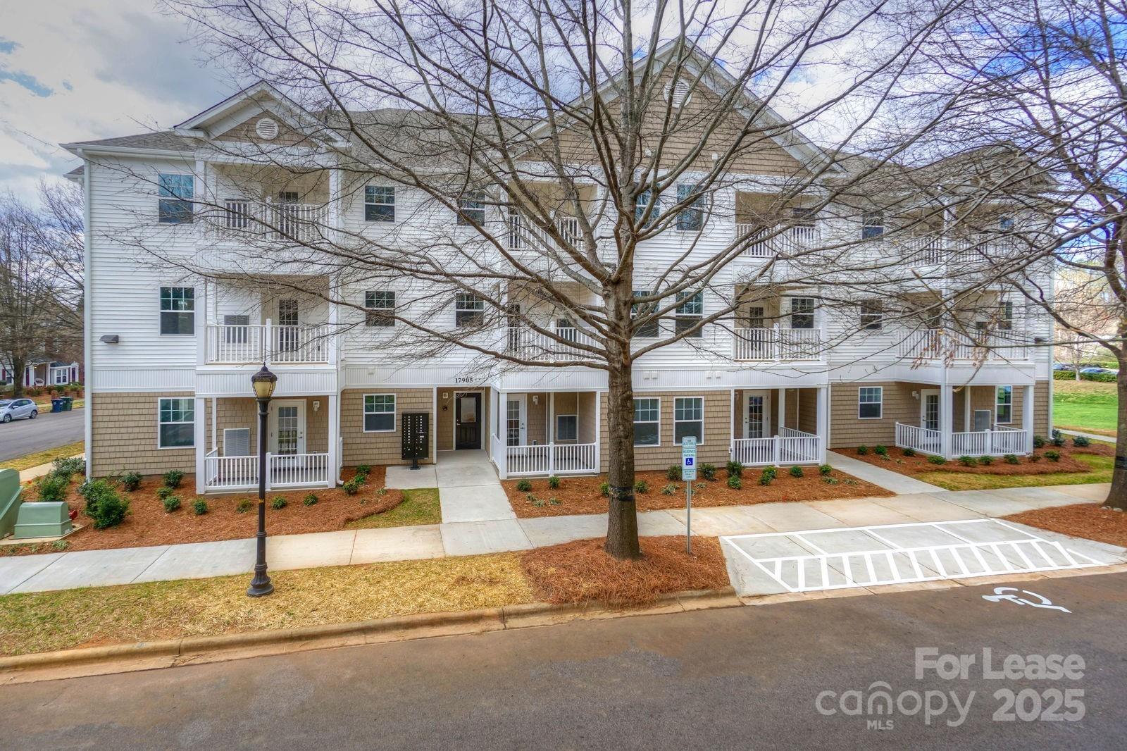 17905 Delmas Drive, Unit 105 Cornelius, NC 28031 - Photo 1 of 16 a front view of a building with street view