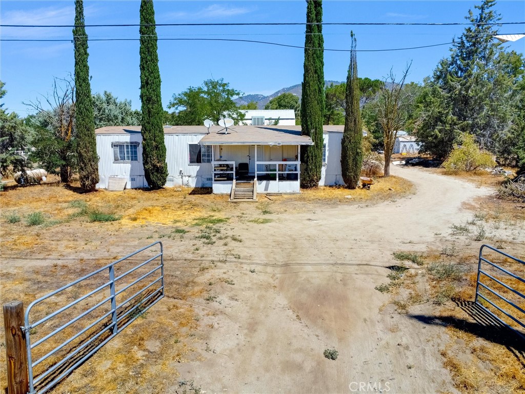 55880 Mitchell Road Anza, CA 92539 - Photo 2 of 27 a view of a house with snow on the road