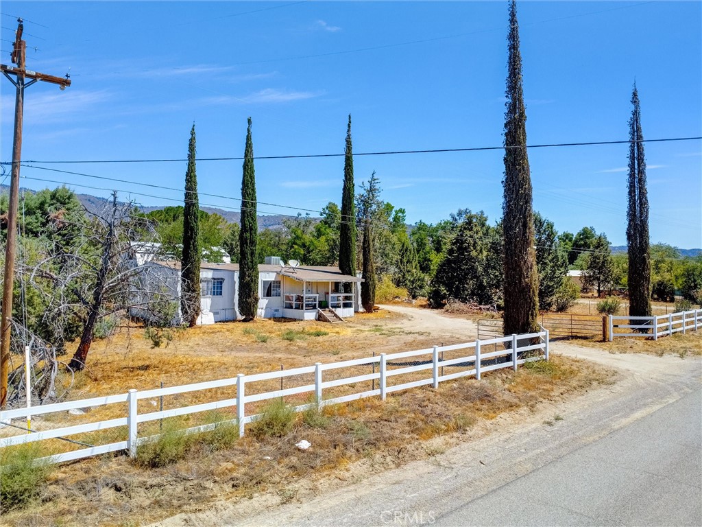 55880 Mitchell Road Anza, CA 92539 - Photo 10 of 27 a view of a street with palm trees next to road