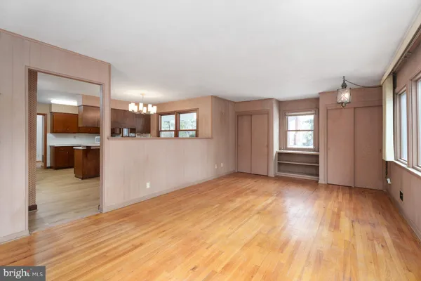a view of a room with window and wooden floor
