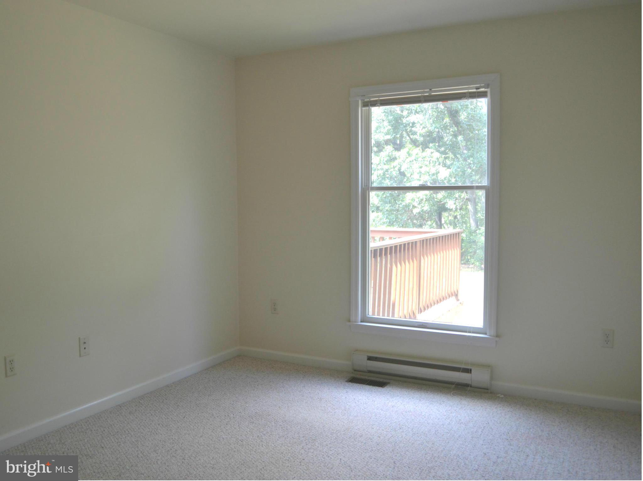 381 Reynolds Road Cross Junction, VA 22625 - Photo 14 of 28 an empty room with a window