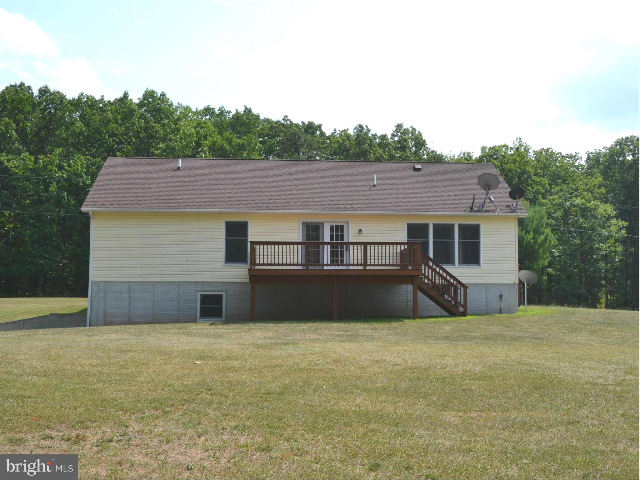 381 Reynolds Road Cross Junction, VA 22625 - Photo 22 of 28 a front view of a house with a yard and garage