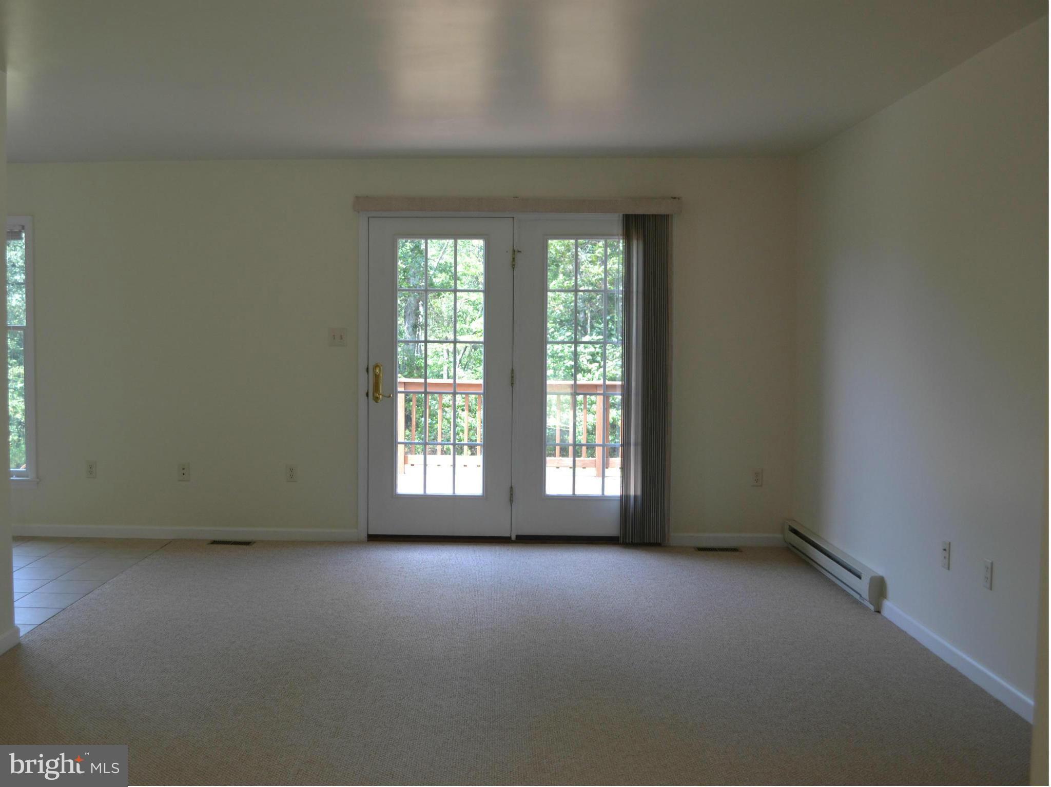 381 Reynolds Road Cross Junction, VA 22625 - Photo 4 of 28 an empty room with a window