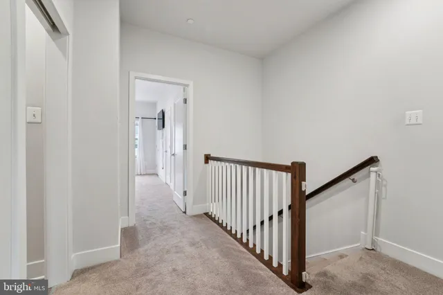 a view of an empty room and closet area
