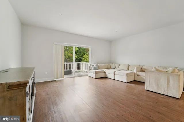 a very nice looking kitchen with a stove a sink a microwave and cabinets