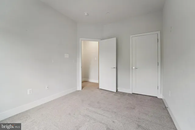 a kitchen with sink and wooden floor