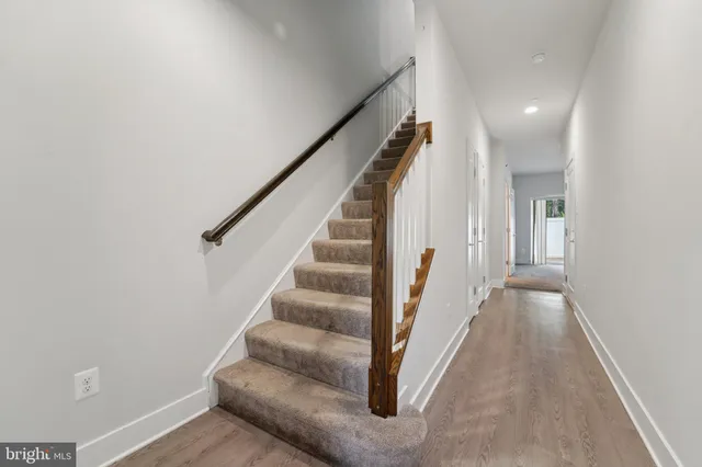 a bathroom with a sink mirror and toilet