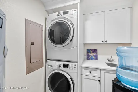a dining room with furniture and front door