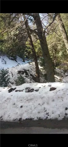 a view of a snow on the road