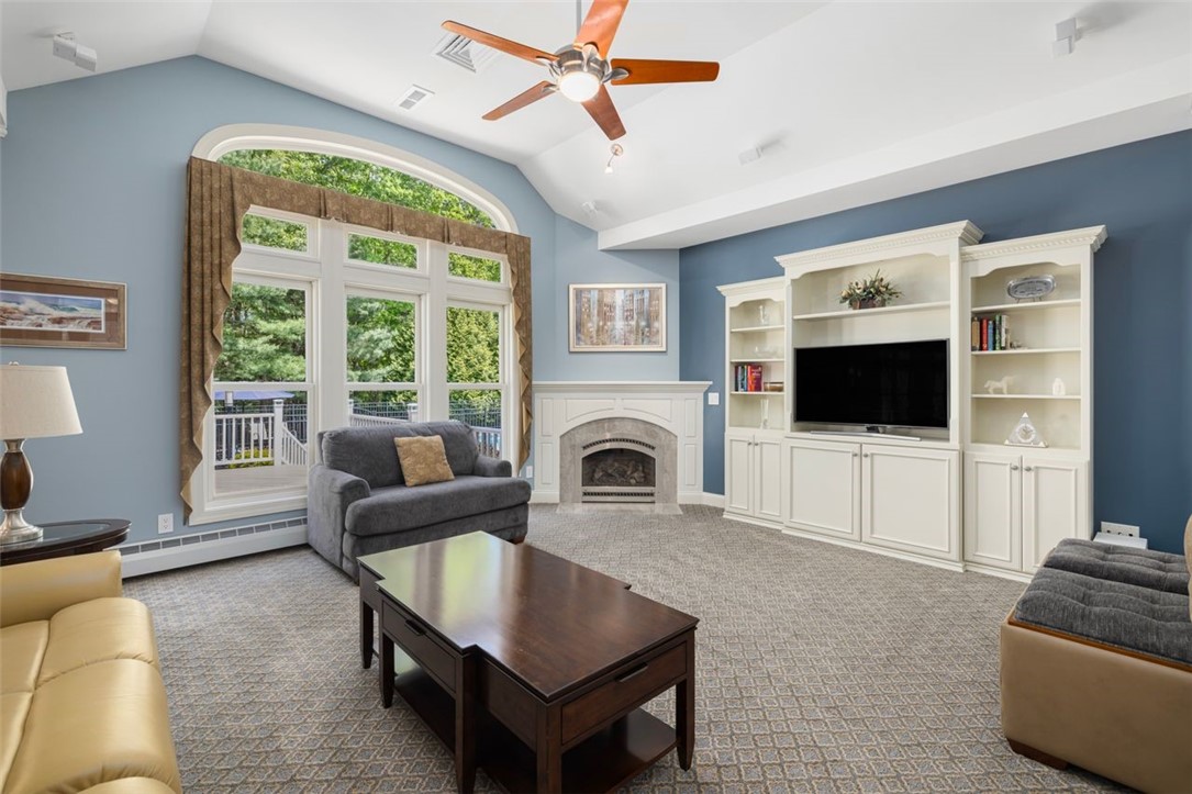 2271 Middle Road East Greenwich, RI 02818 - Photo 11 of 50 The living room has a vaulted ceiling and an abundance of natural light