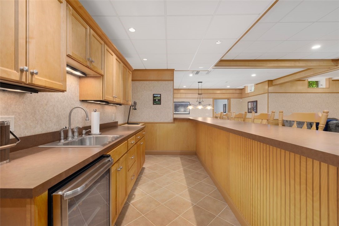 2271 Middle Road East Greenwich, RI 02818 - Photo 35 of 50 Lower level wet bar and a bar height counter that seats 8