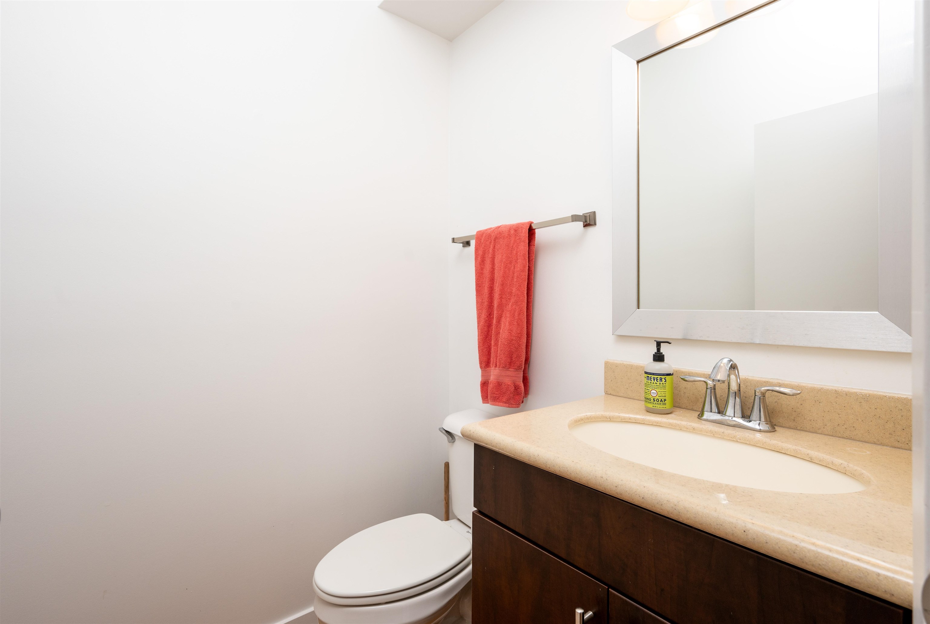 379 Cobalt Bay Loop, Unit 102 Memphis, TN 38103 - Photo 14 of 21 a bathroom with a sink vanity mirror and toilet