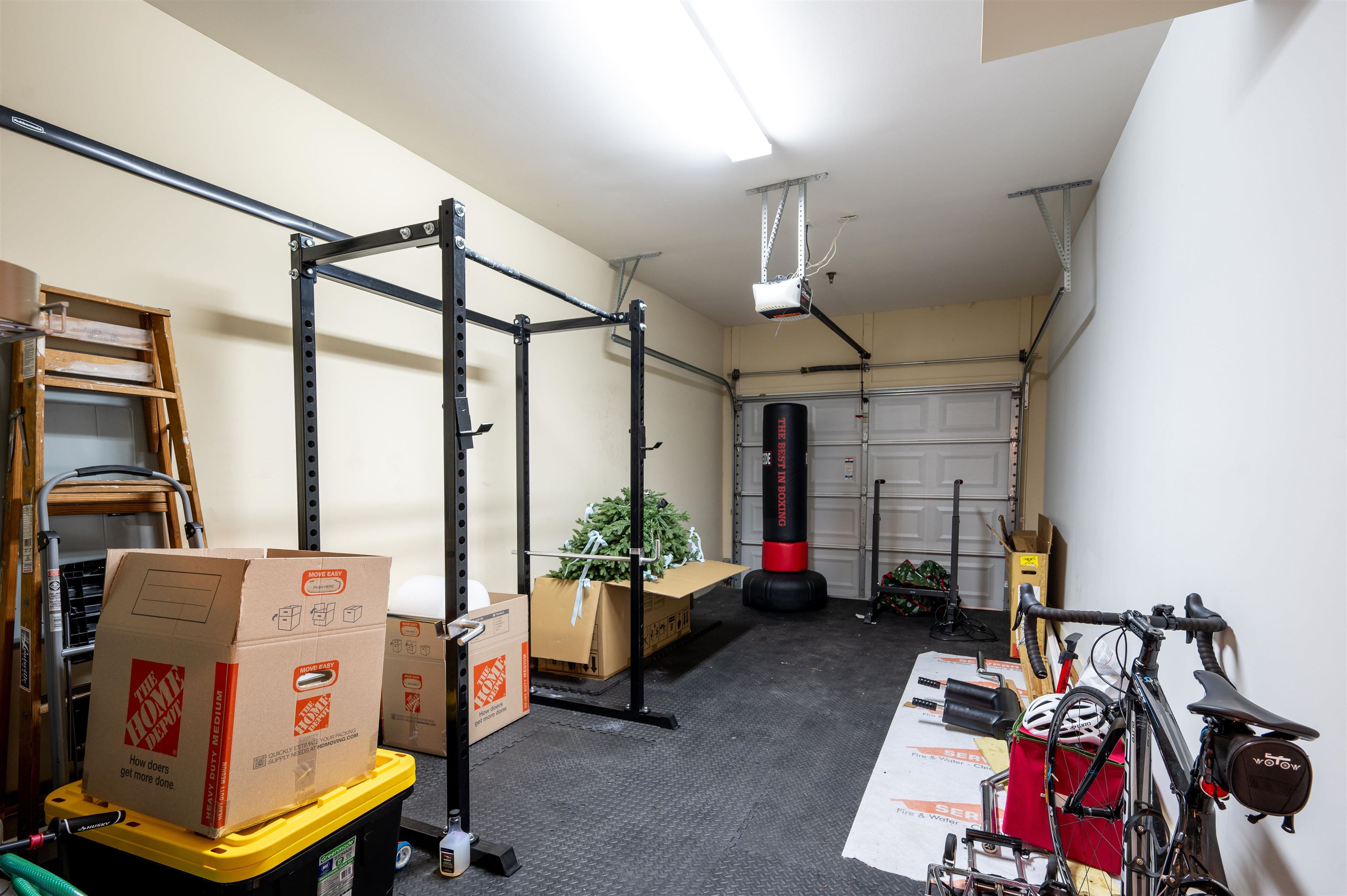 379 Cobalt Bay Loop, Unit 102 Memphis, TN 38103 - Photo 20 of 21 a living room with furniture gym equipment and a flat screen tv