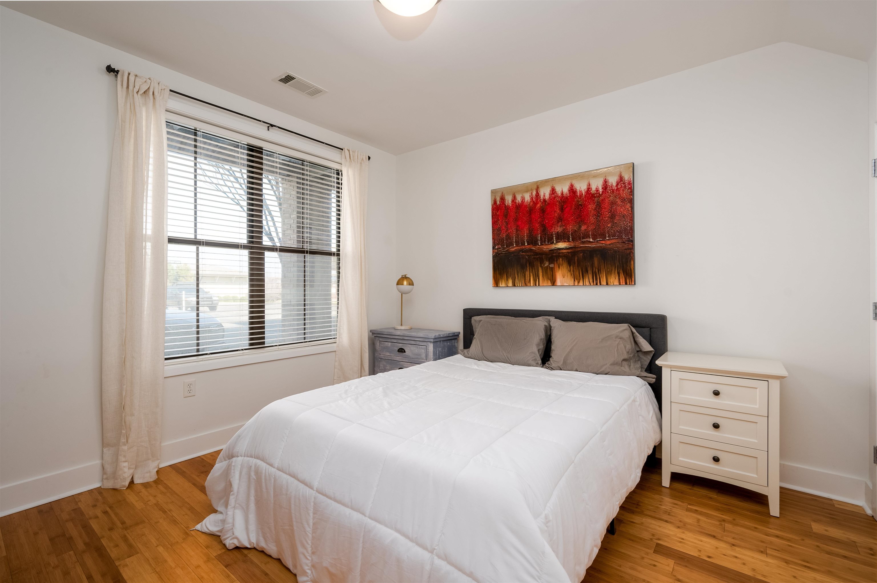 379 Cobalt Bay Loop, Unit 102 Memphis, TN 38103 - Photo 5 of 21 a bedroom with a bed and a window