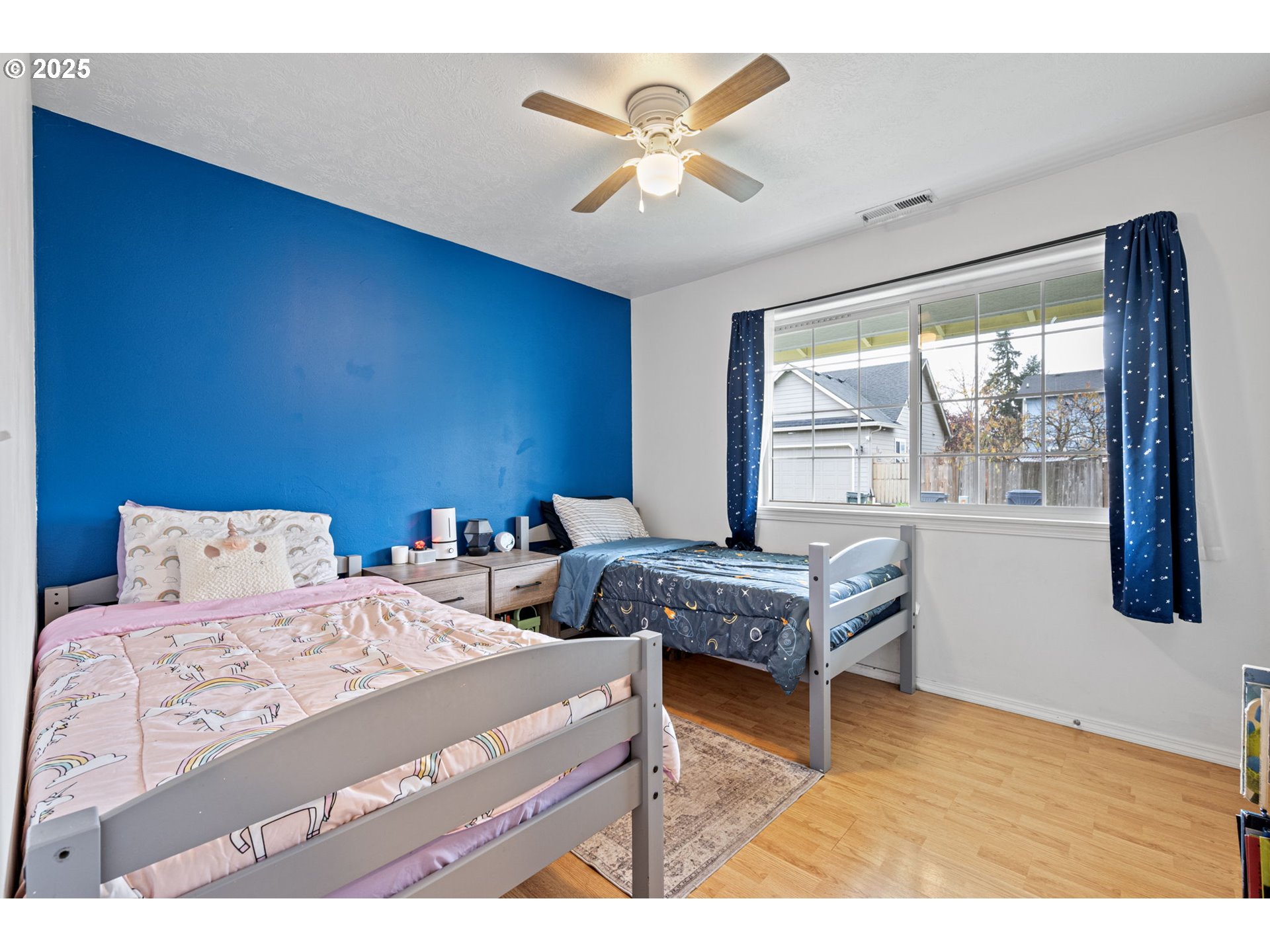 3785 Dove Lane Eugene, OR 97402 - Photo 24 of 43 a bedroom with a bed and a large window