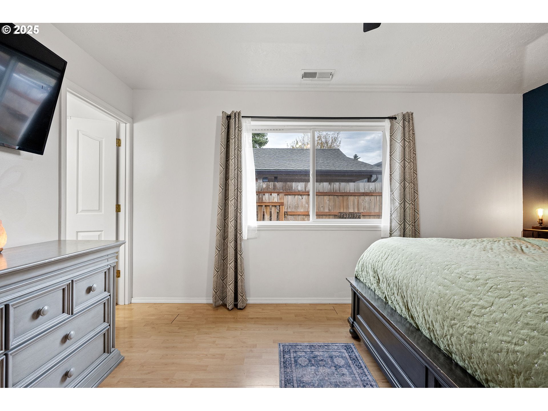 3785 Dove Lane Eugene, OR 97402 - Photo 29 of 43 a bedroom with a bed and a window