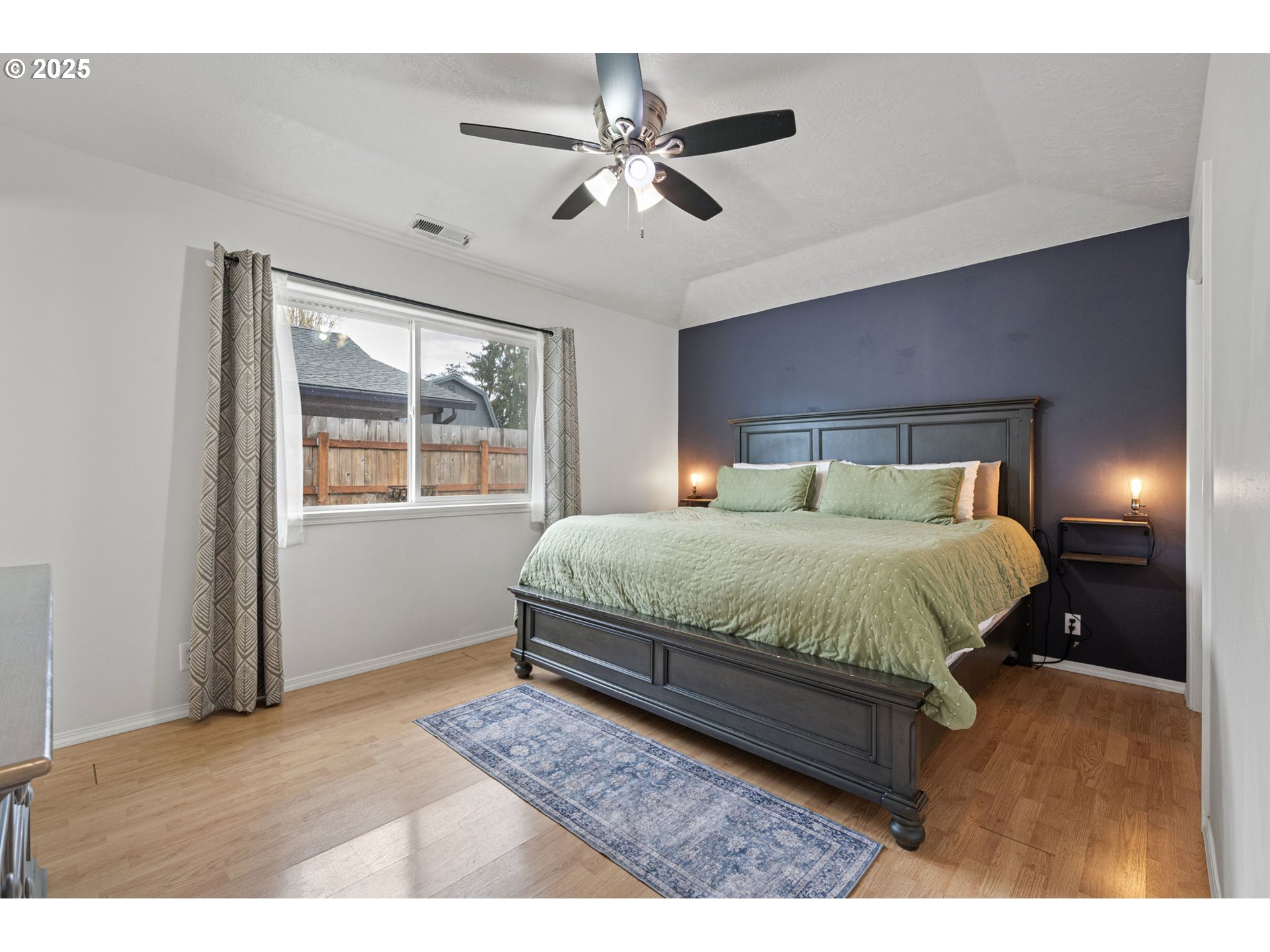 3785 Dove Lane Eugene, OR 97402 - Photo 30 of 43 a bedroom with a large bed and a window