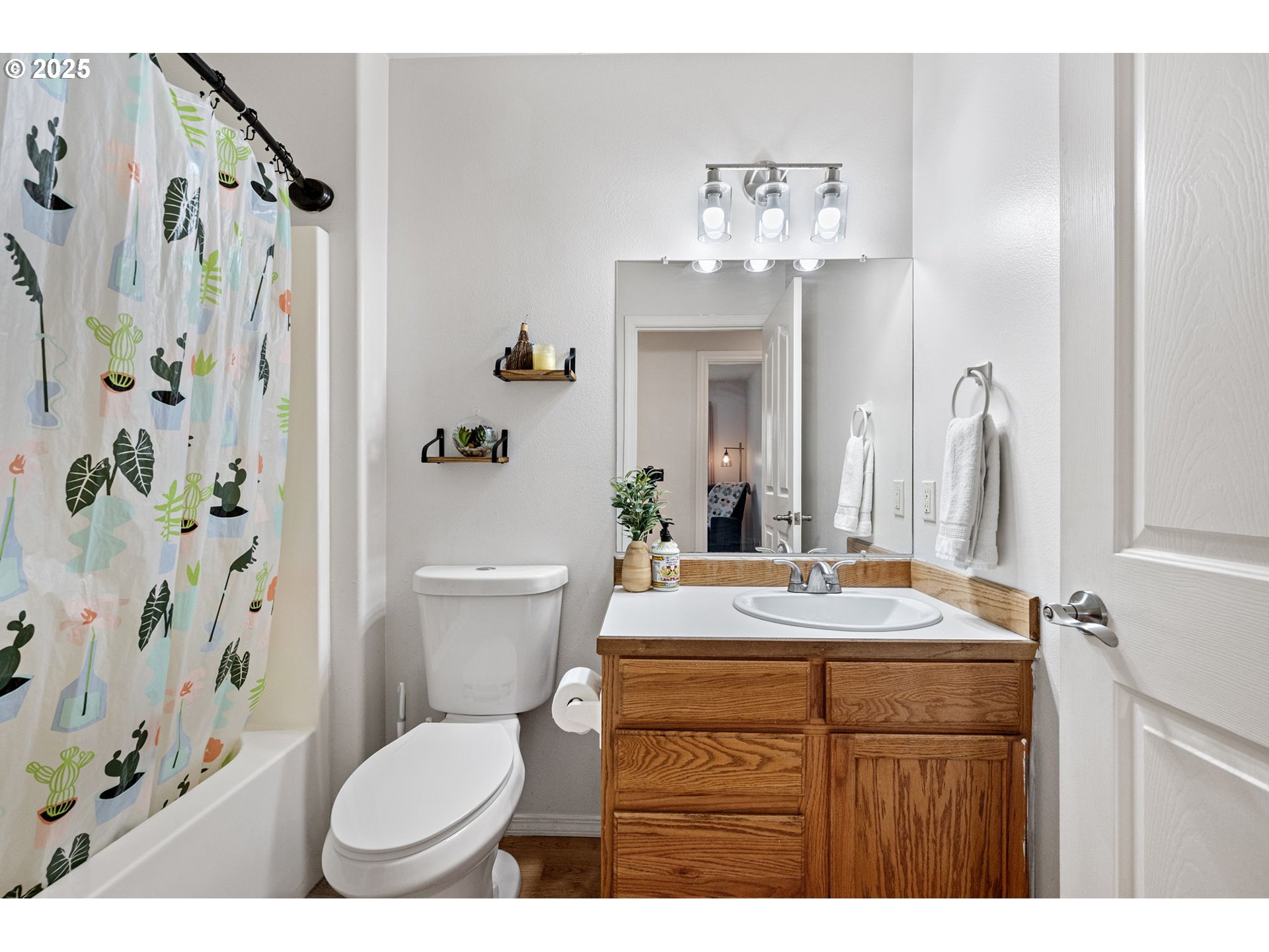 3785 Dove Lane Eugene, OR 97402 - Photo 33 of 43 a bathroom with a sink vanity mirror and toilet