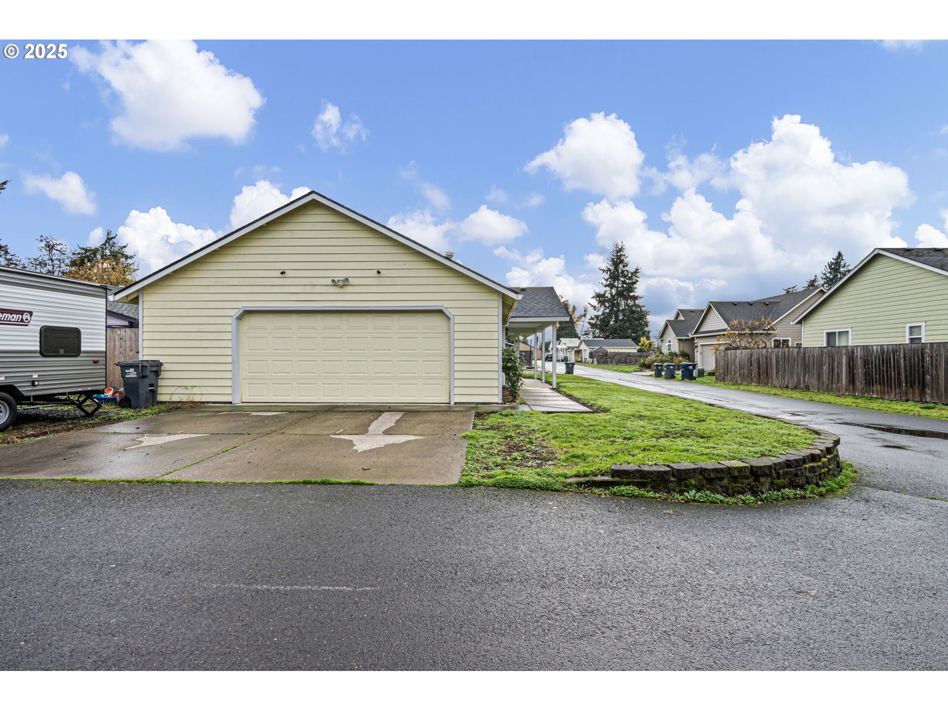 3785 Dove Lane Eugene, OR 97402 - Photo 42 of 43 a front view of a house with a yard and garage