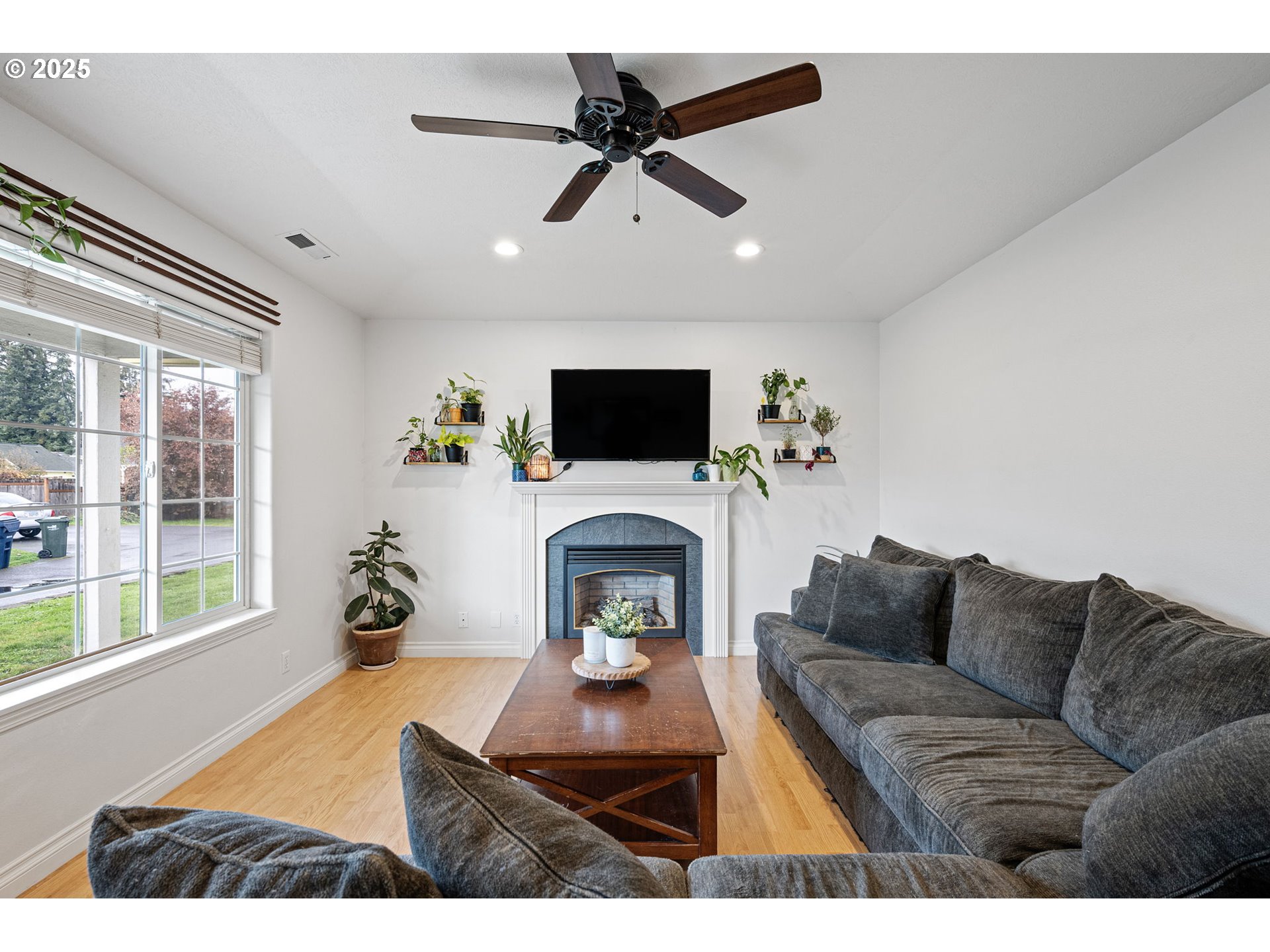 3785 Dove Lane Eugene, OR 97402 - Photo 5 of 43 a living room with furniture a fireplace and a flat screen tv