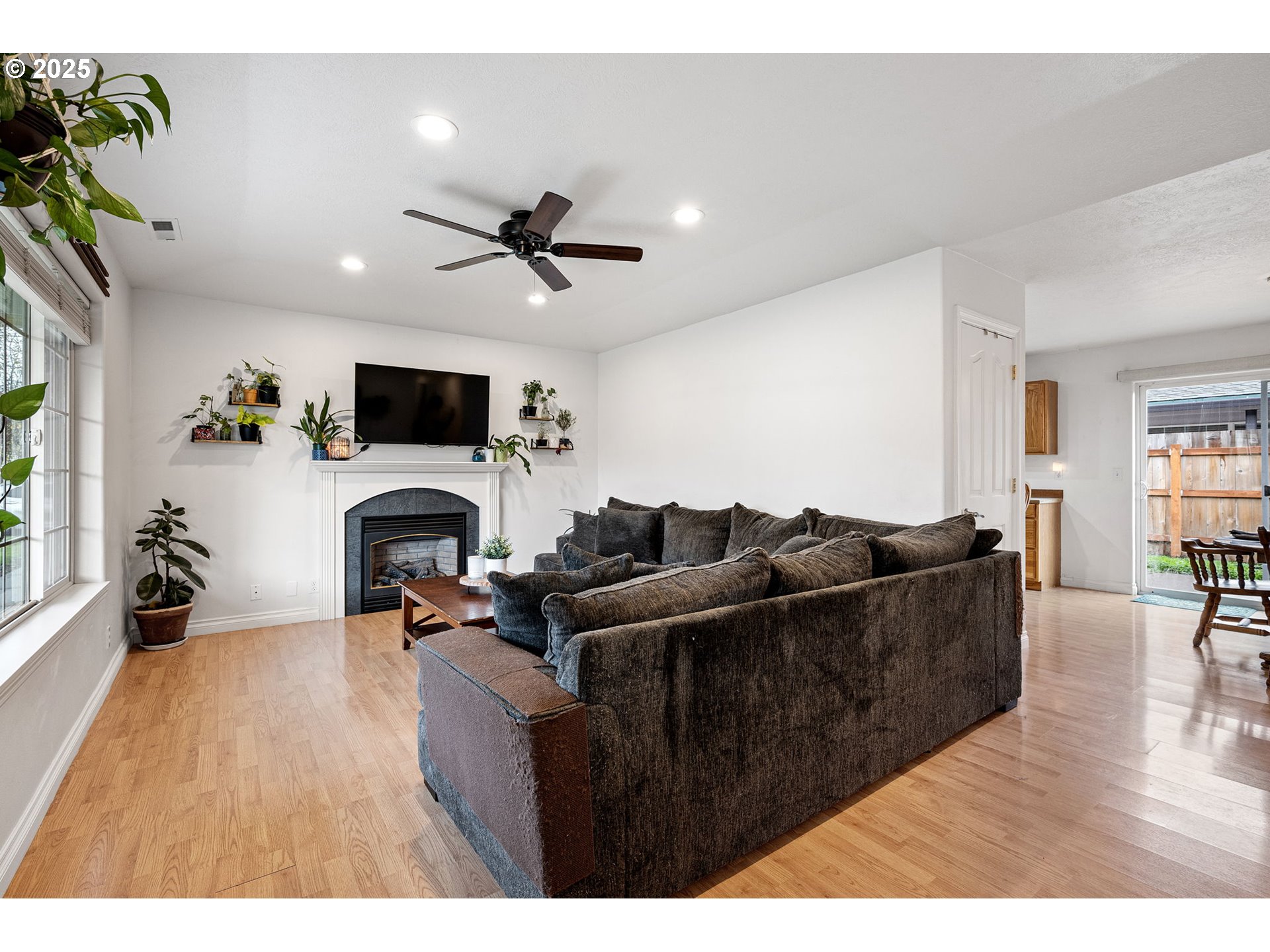 3785 Dove Lane Eugene, OR 97402 - Photo 7 of 43 a living room with furniture and a flat screen tv