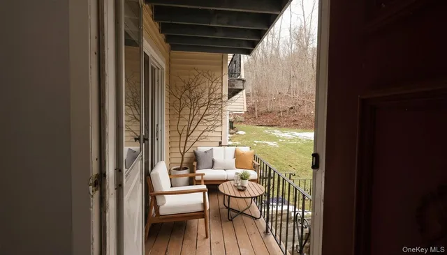 a view of living room with furniture and wooden floor