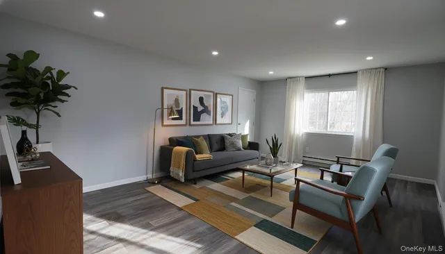 a living room with furniture rug and window