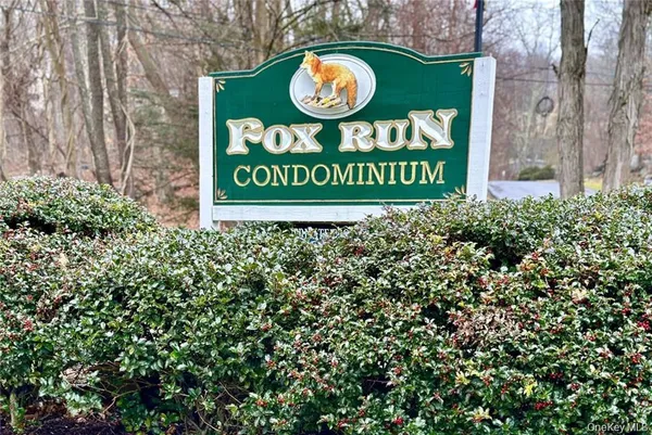 a sign that is on a brick wall