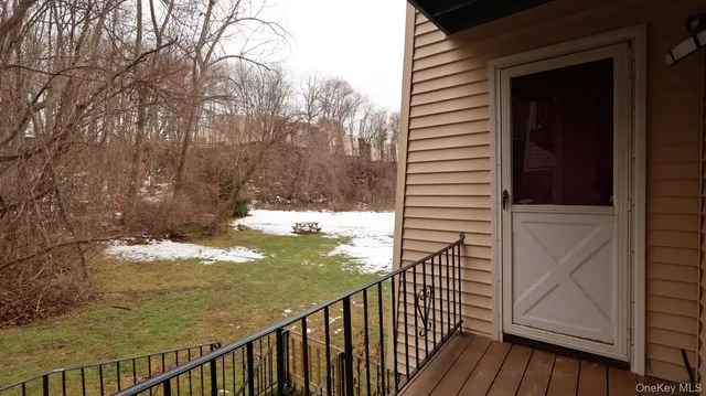 a view of balcony with wooden floor