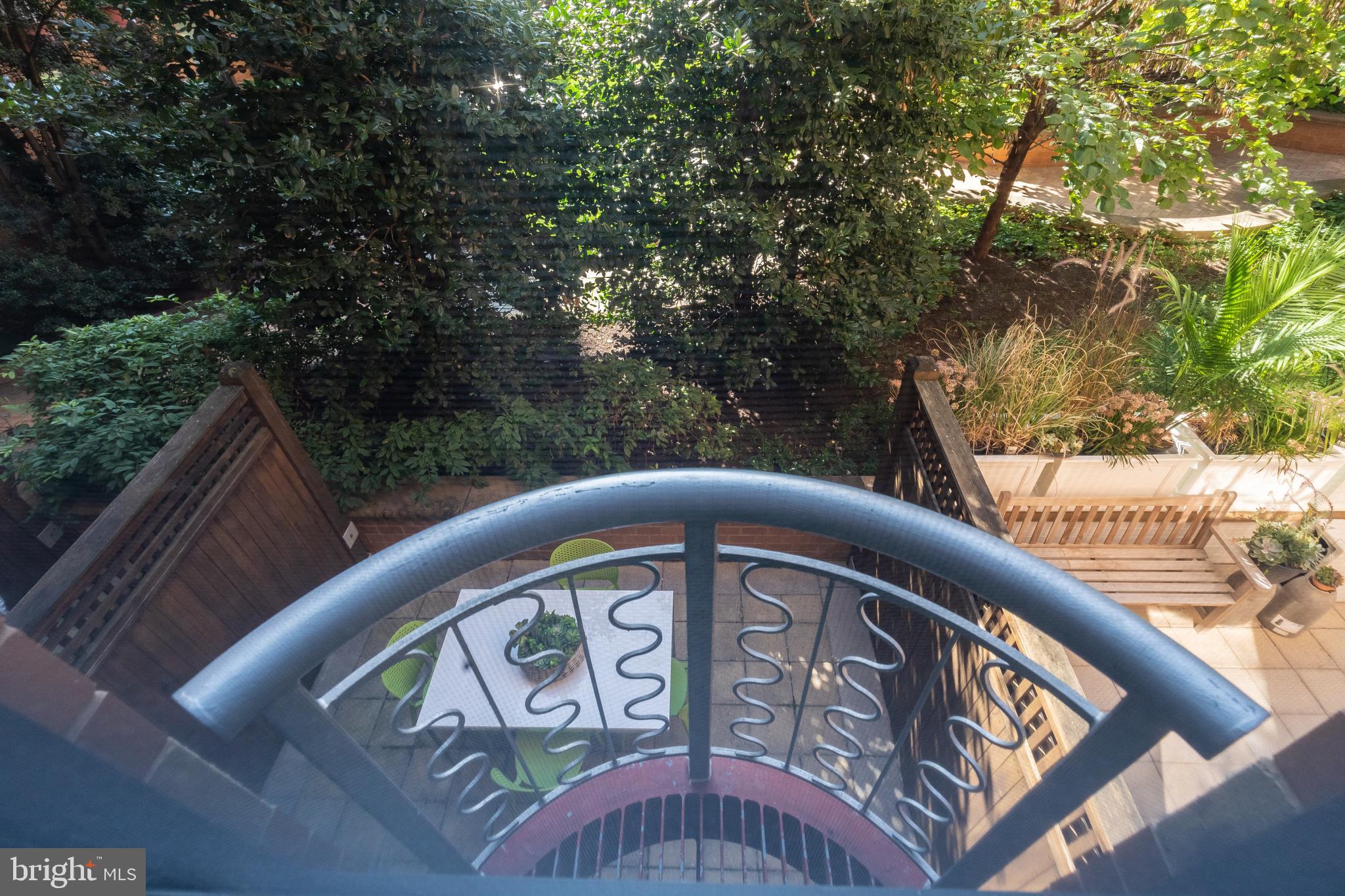 631 D Street Northwest, Unit 241 Washington, DC 20004 - Photo 19 of 81 a view of a wooden bench and trees in the balcony