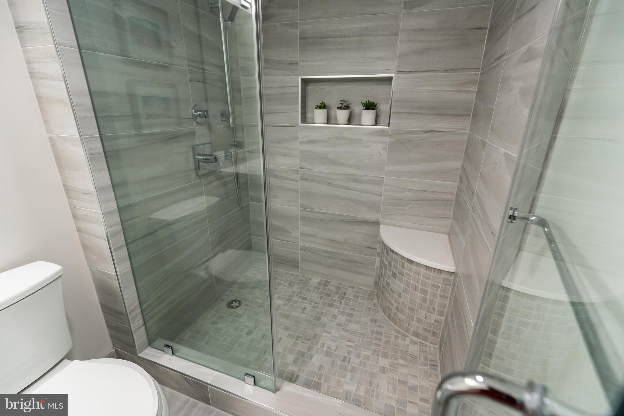 631 D Street Northwest, Unit 241 Washington, DC 20004 - Photo 21 of 81 a bathroom with a shower and toilet