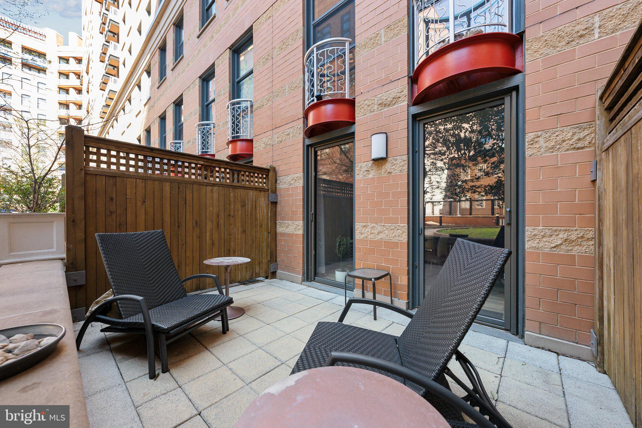 631 D Street Northwest, Unit 241 Washington, DC 20004 - Photo 9 of 81 a view of a patio with a table and chairs