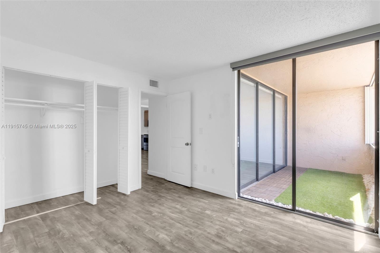 10400 Southwest 108th Avenue, Unit A413 Miami, FL 33176 - Photo 17 of 25 a view of an empty room with window