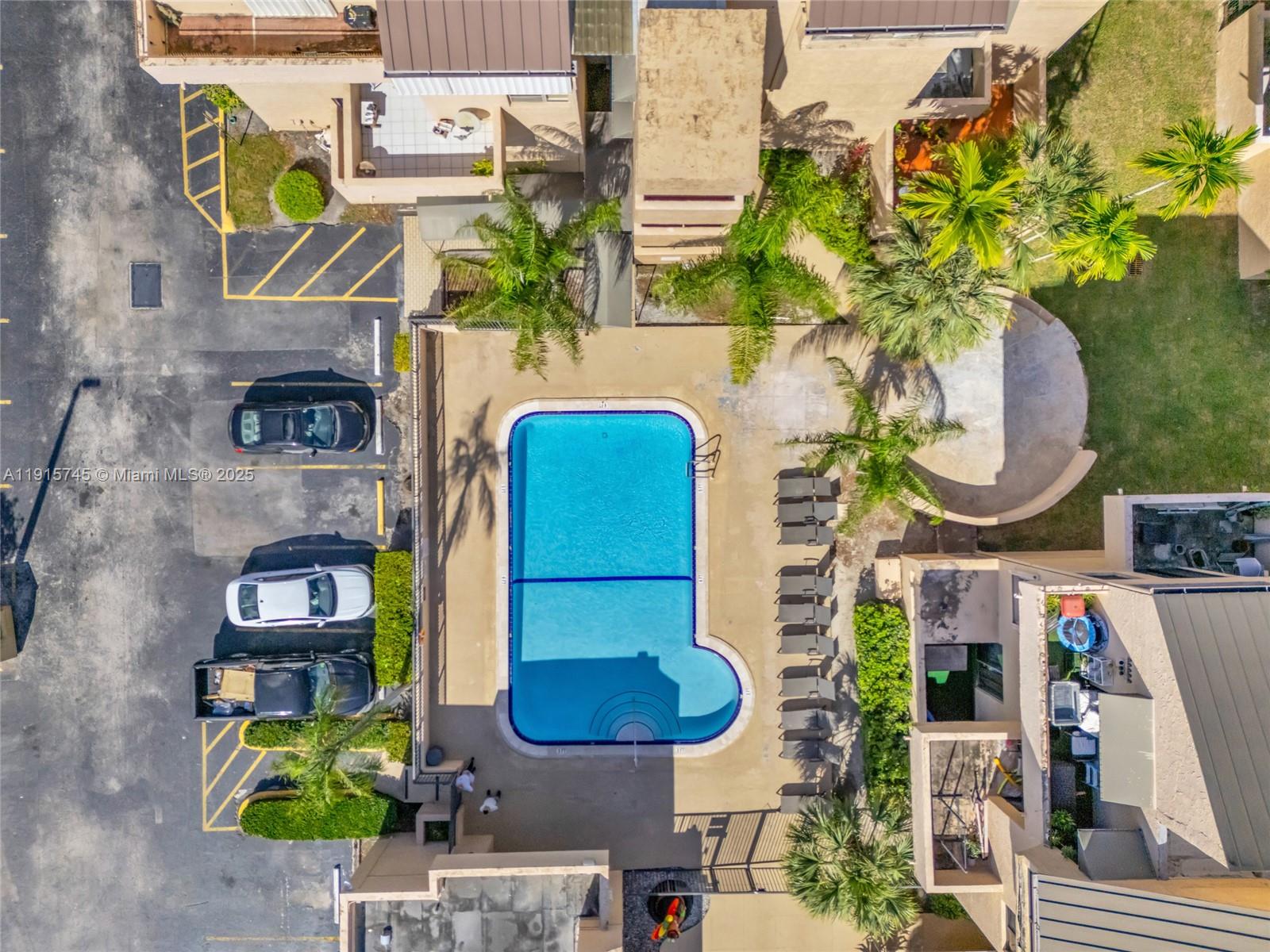 10400 Southwest 108th Avenue, Unit A413 Miami, FL 33176 - Photo 25 of 25 aerial view of a fireplace with table and chairs