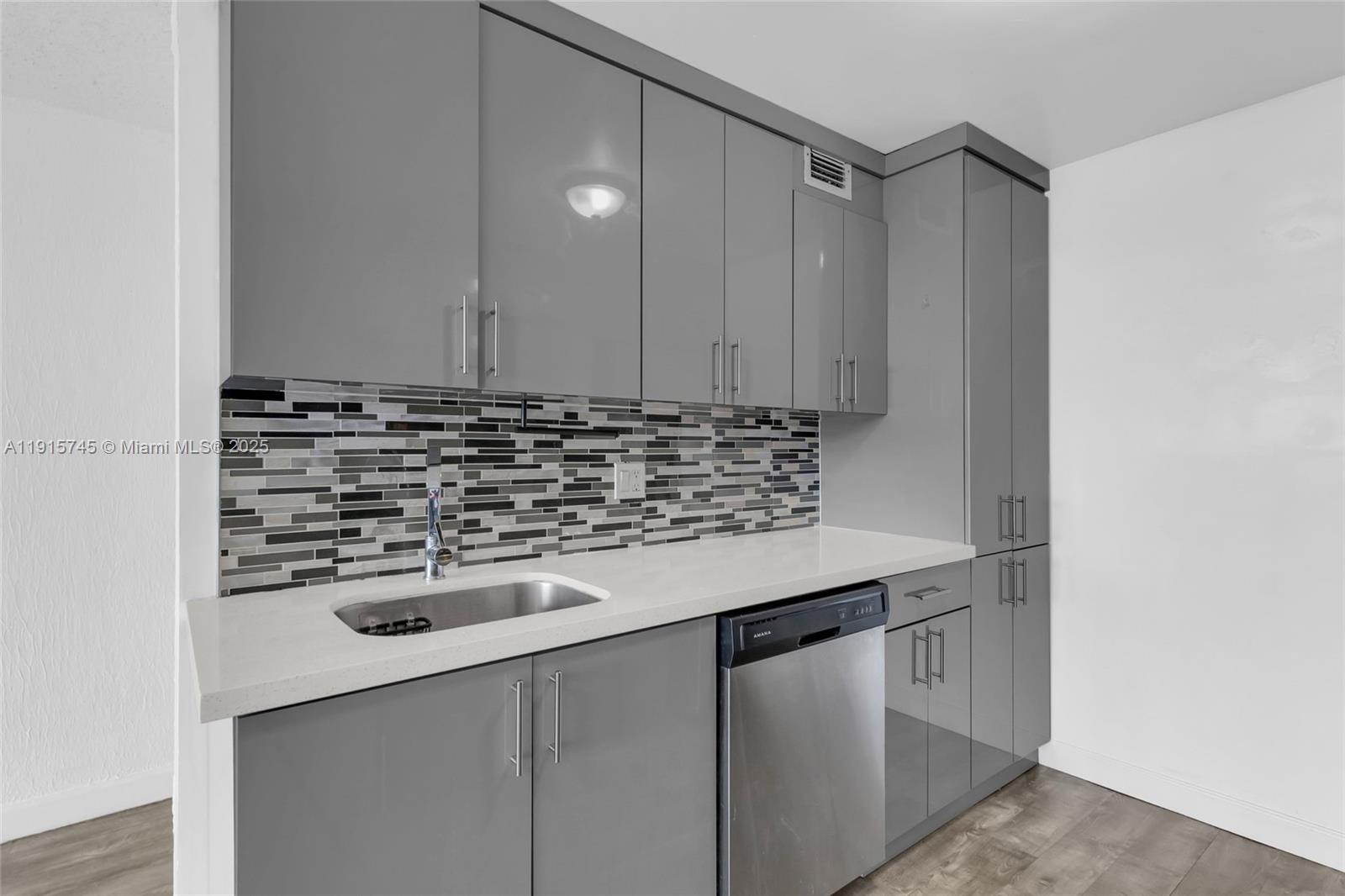 10400 Southwest 108th Avenue, Unit A413 Miami, FL 33176 - Photo 4 of 25 a view of a sink and cabinets