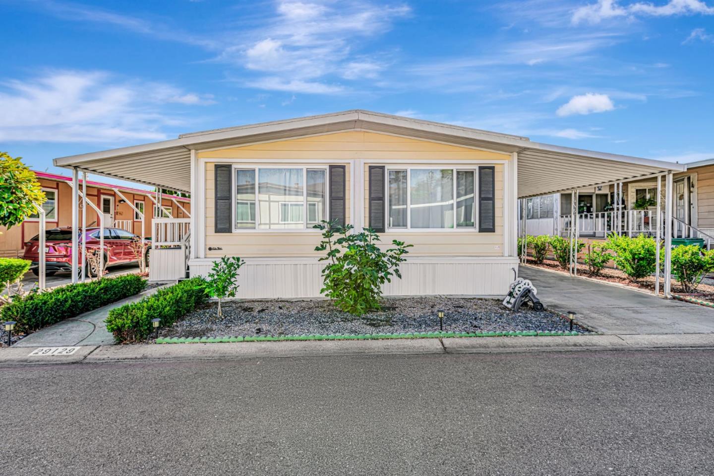 a front view of house with yard and green space