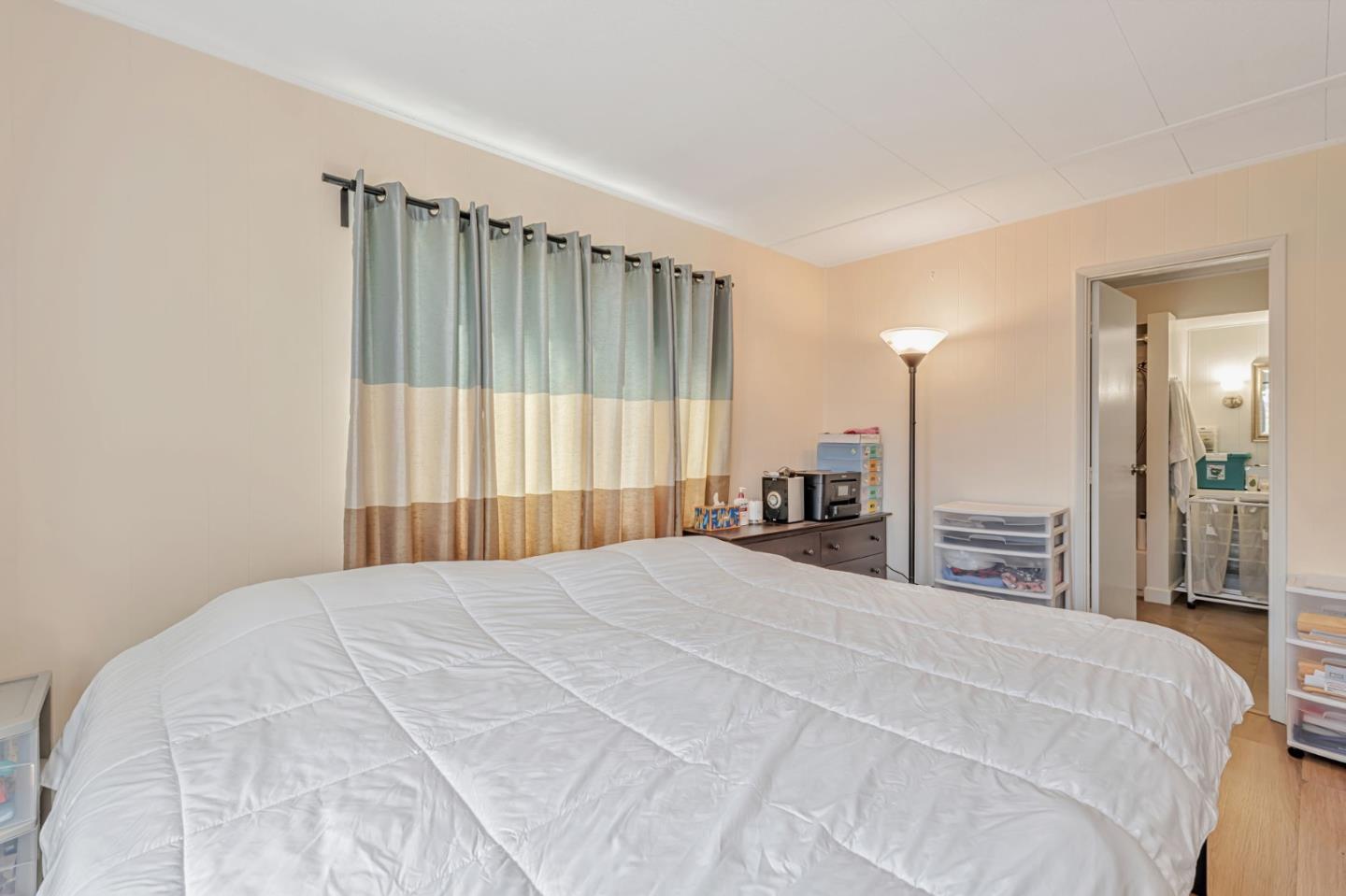 29129 Verdi Road, Unit 29129 Hayward, CA 94544 - Photo 17 of 37 a large bedroom with a bed and a large mirror