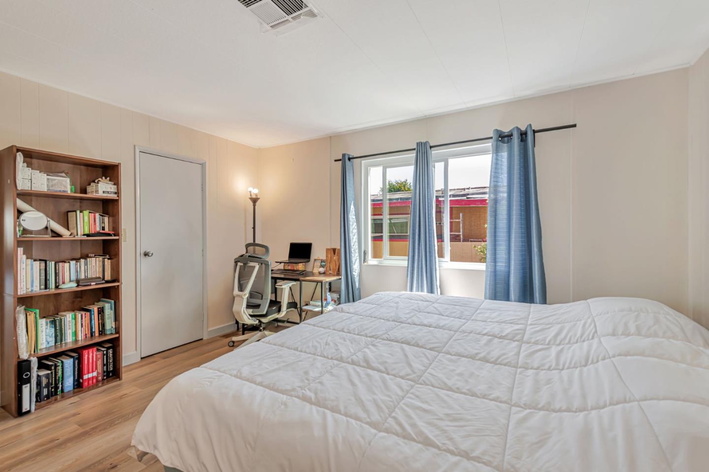 29129 Verdi Road, Unit 29129 Hayward, CA 94544 - Photo 18 of 37 a bedroom with a bed and a book shelf