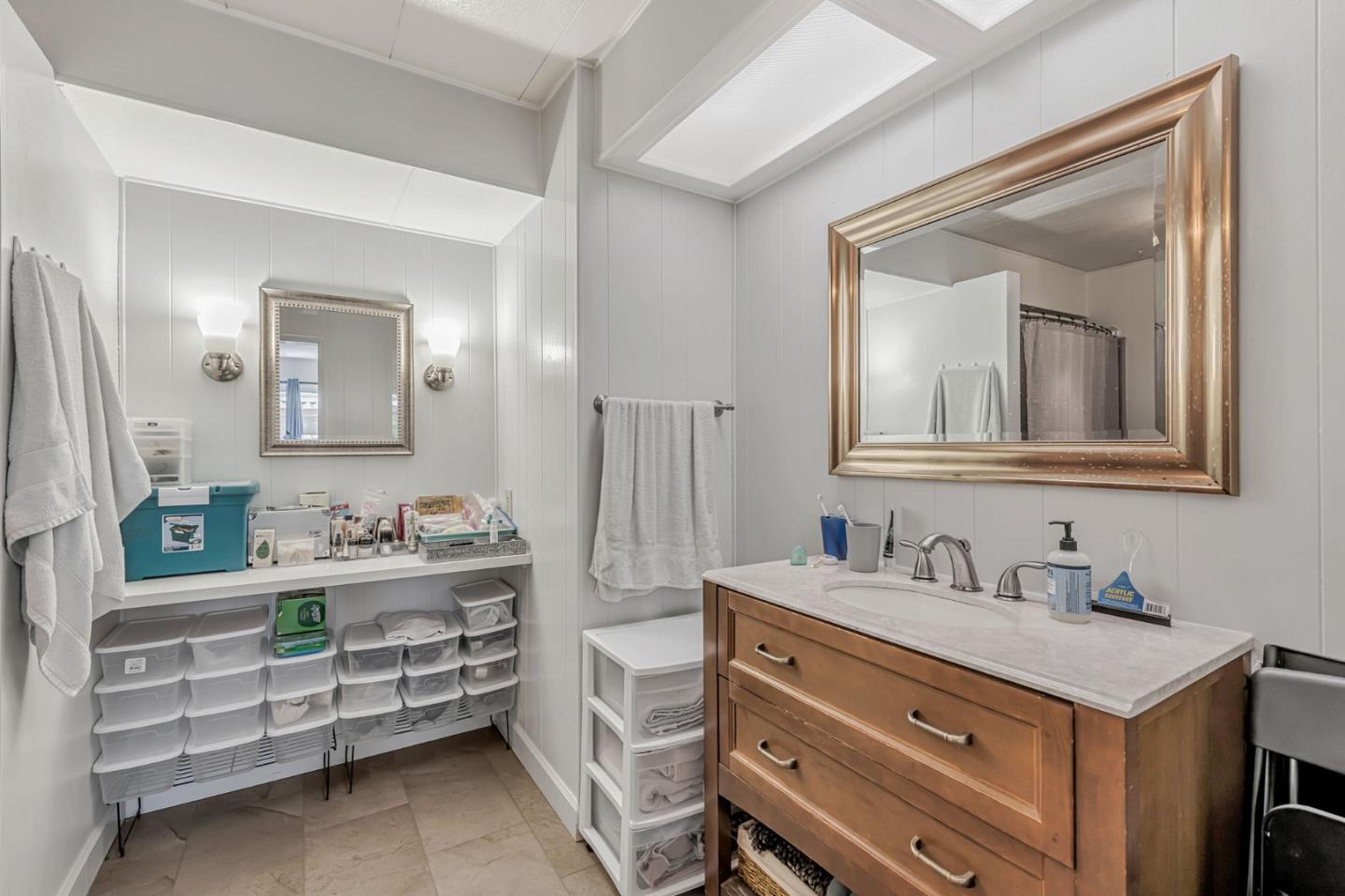 29129 Verdi Road, Unit 29129 Hayward, CA 94544 - Photo 21 of 37 a bathroom with a double vanity sink and mirror